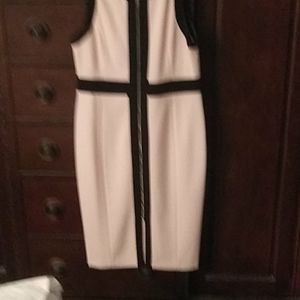 Pink dress with black trim.